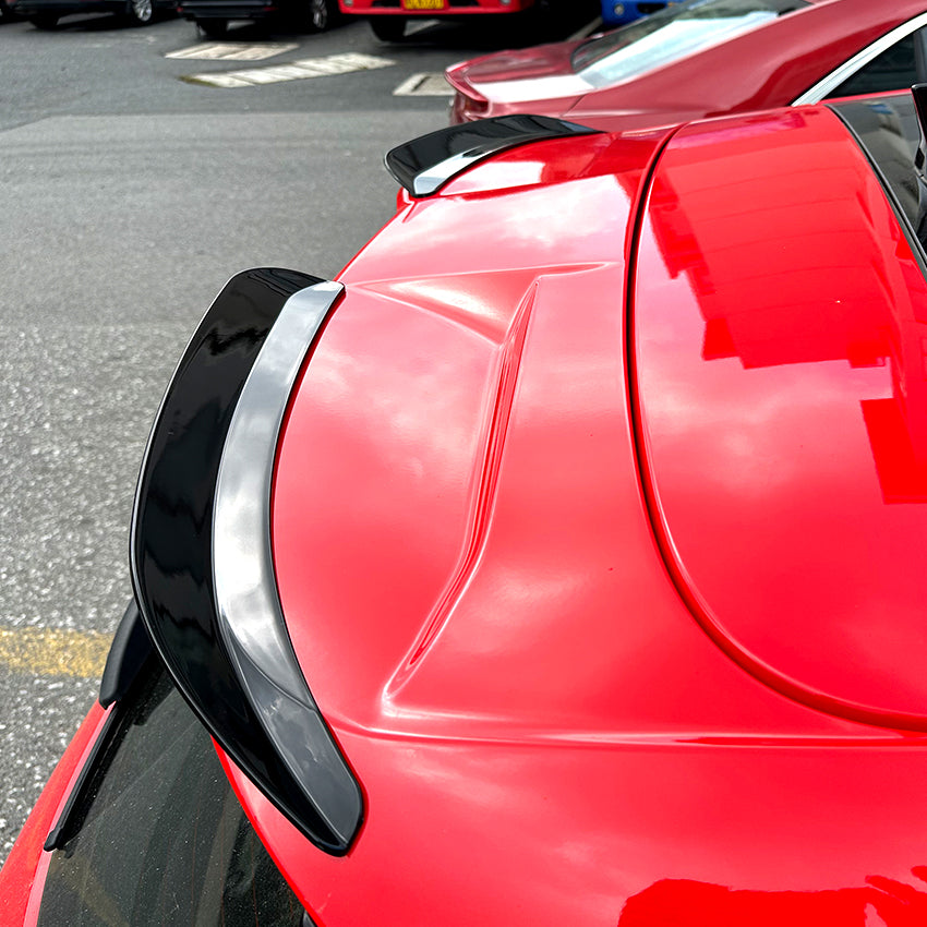 Gloss black roof spoiler for Ford Focus ST C519 MK4 2019-2022, showing sleek, aerodynamic design on the vehicle's rear roof.