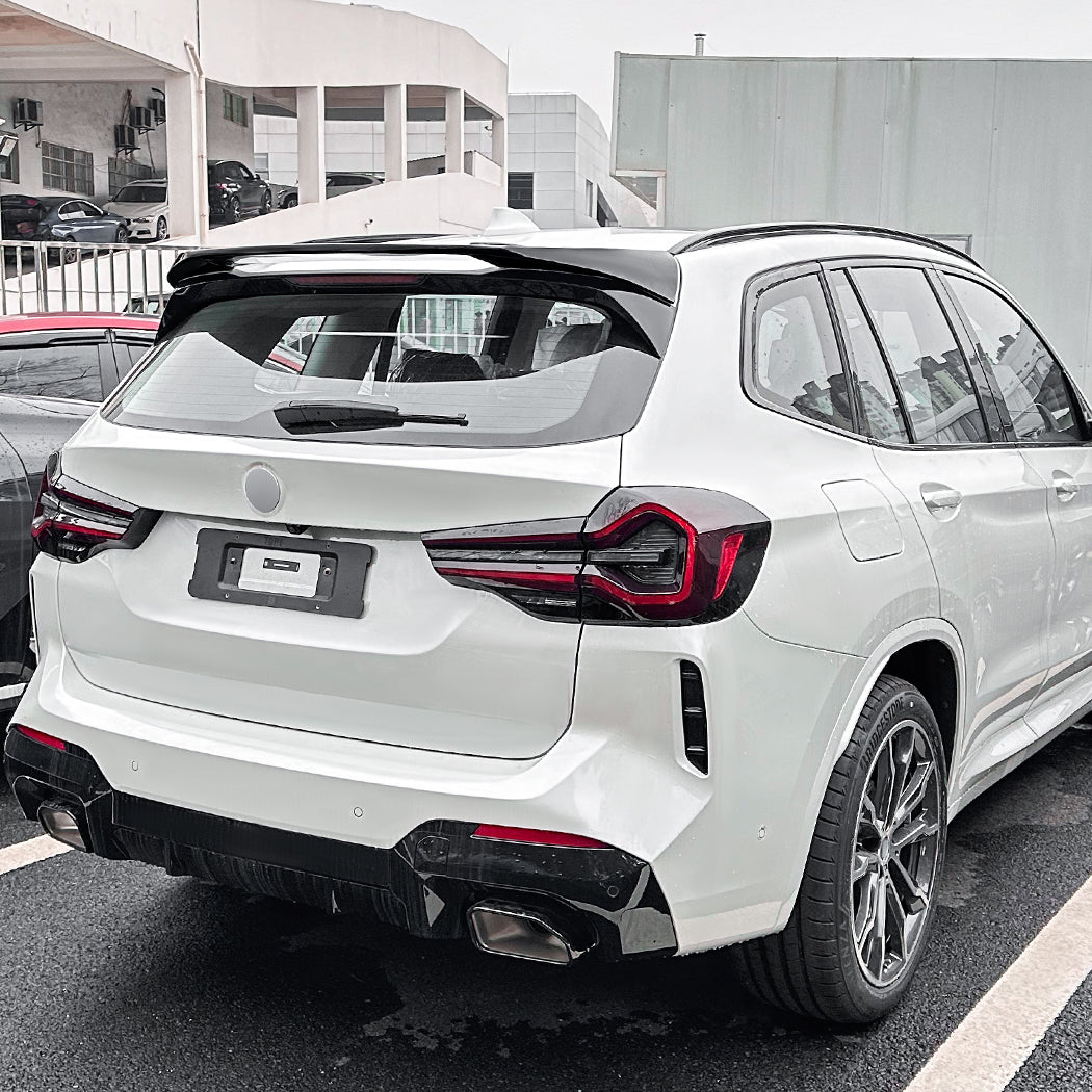 Gloss black roof spoiler for BMW G01 X3 and ix3, showcasing sleek, aerodynamic design on a dark-colored vehicle.