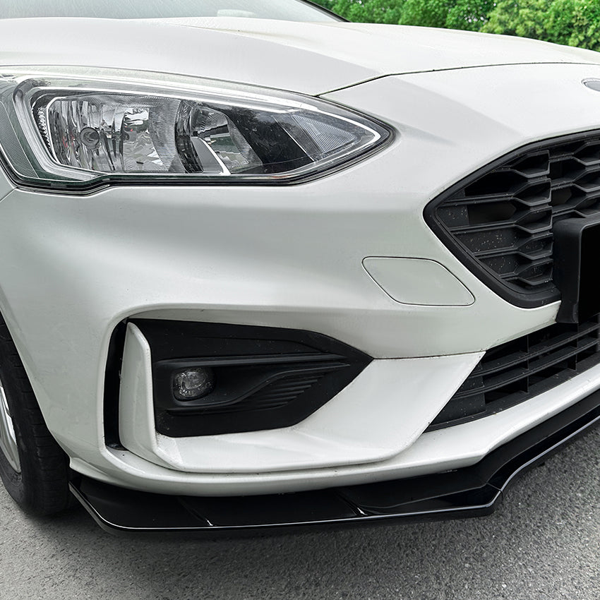 Gloss black front splitter for Ford Focus ST C519 MK4 2019-2022, showing the aerodynamic splitter design mounted on the vehicle.