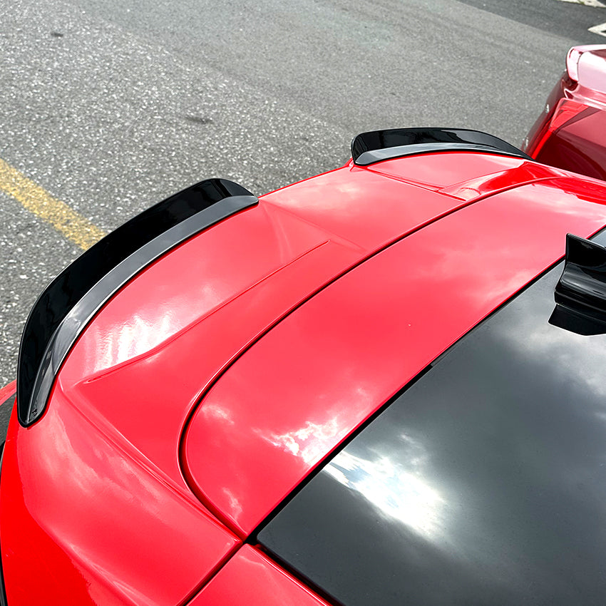 Gloss black roof spoiler for Ford Focus ST C519 MK4 2019-2022, shown installed on the vehicle's rear roof area.