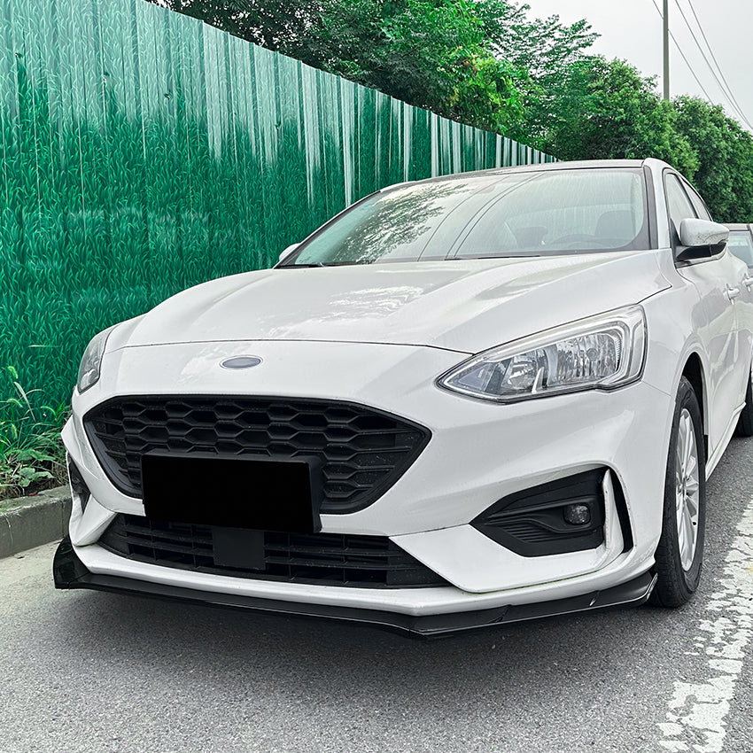 Gloss black front splitter for Ford Focus ST C519 MK4 2019-2022, showing the sleek, aerodynamic design and fitment details.