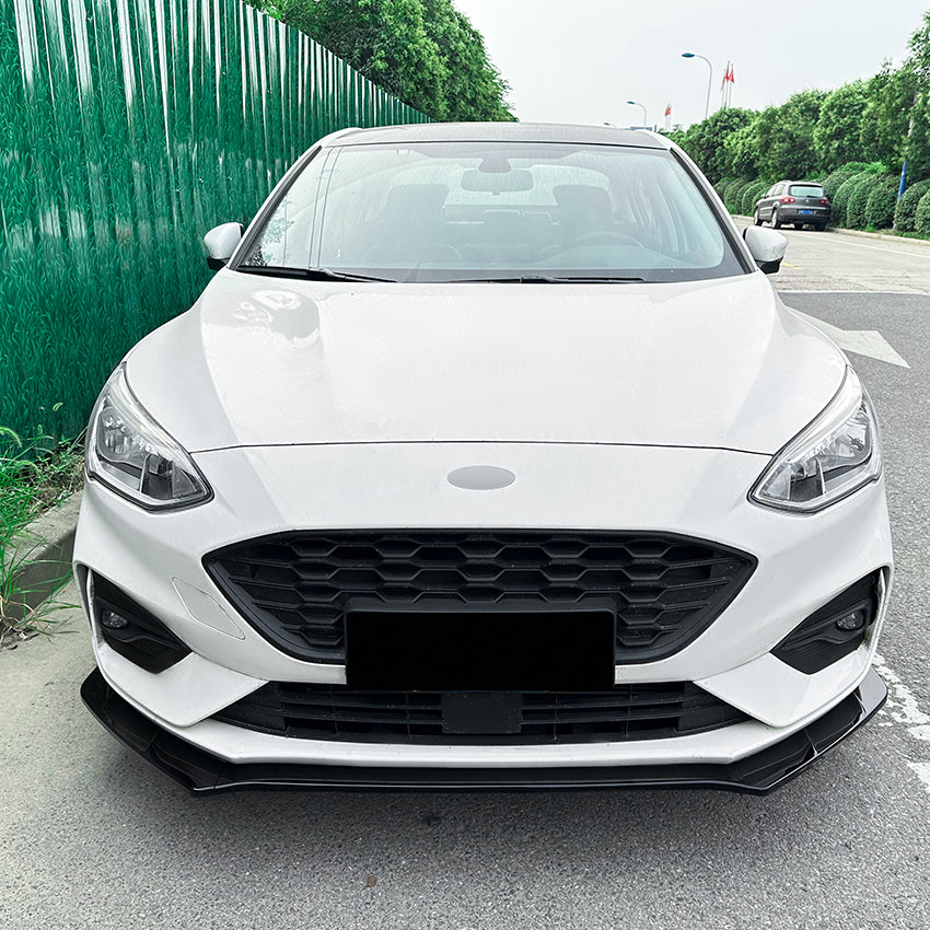 Gloss black front splitter for Ford Focus ST C519 MK4 2019-2022, enhances aerodynamics and sporty appearance.