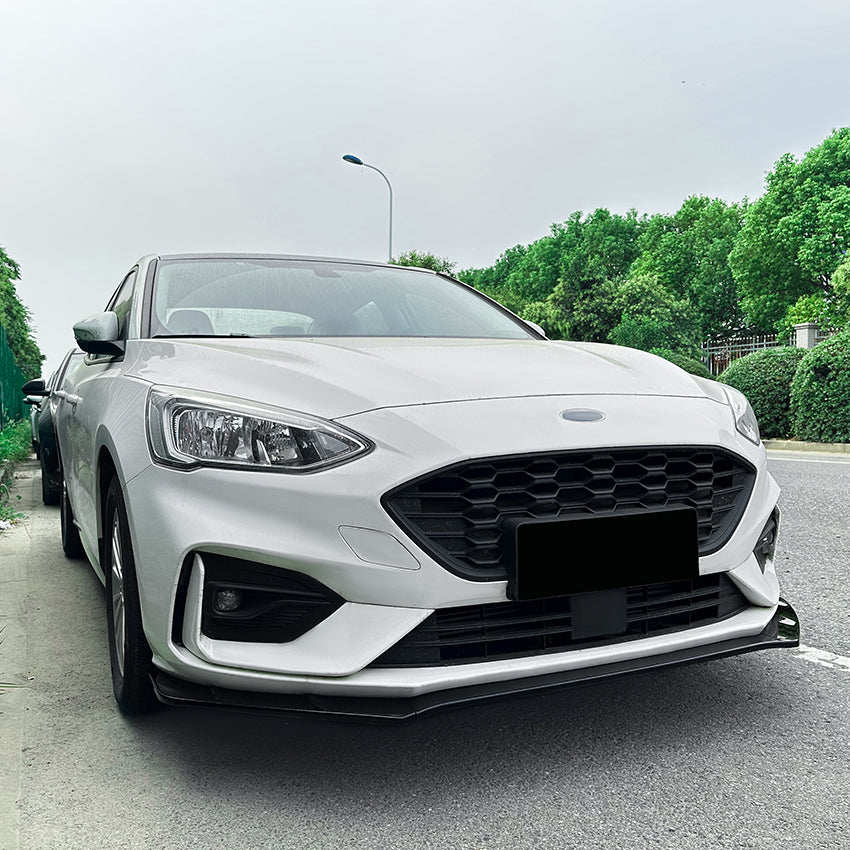 Gloss black front splitter for Ford Focus ST C519 MK4 2019-2022, showing the aerodynamic design and glossy finish.