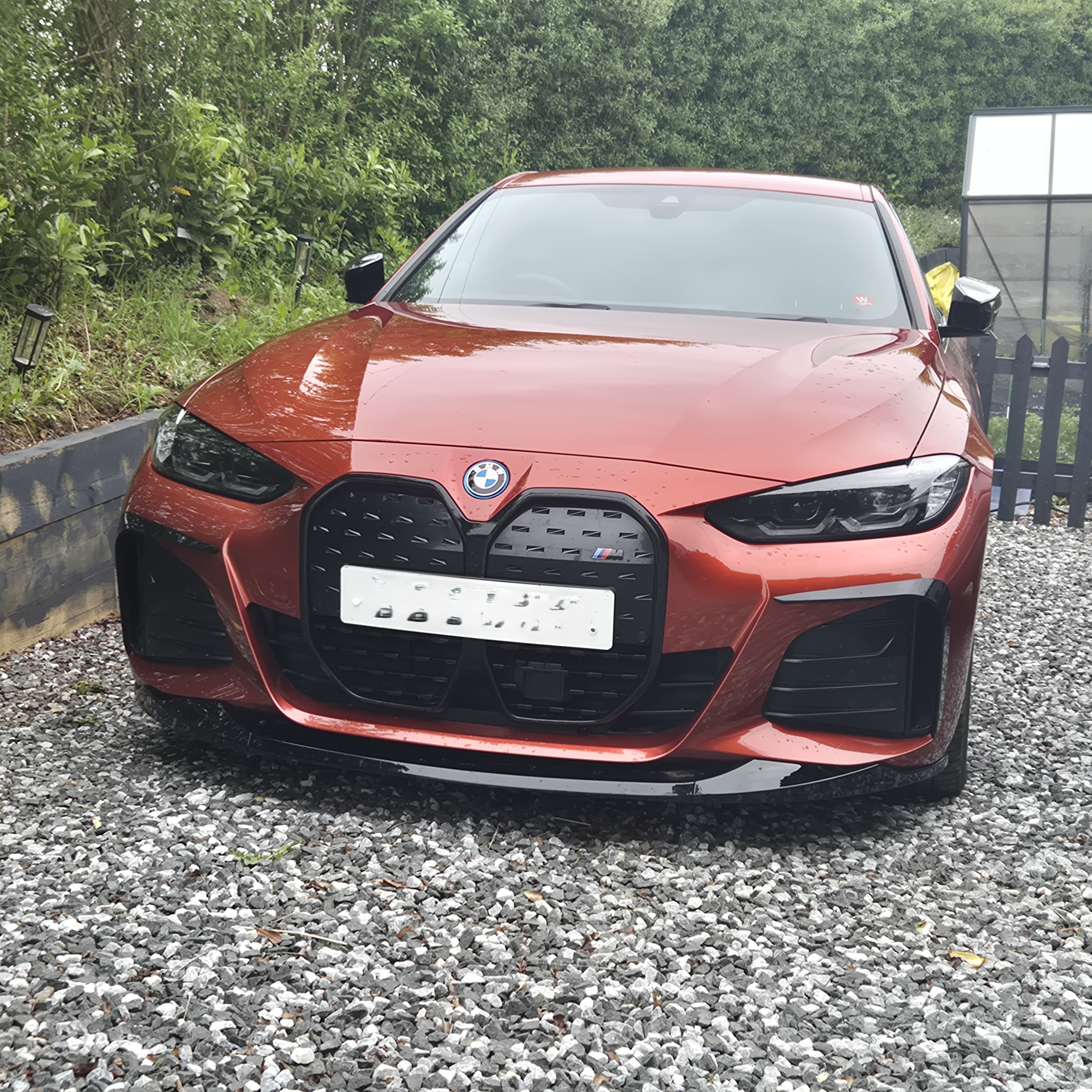 Gloss black front splitter for BMW 4 Series G26 Gran Coupe i4, enhancing aerodynamics and sporty appearance.