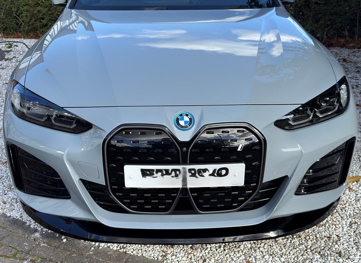 Gloss black front splitter for BMW 4 Series G26 Gran Coupe i4, enhancing aerodynamics and vehicle style.