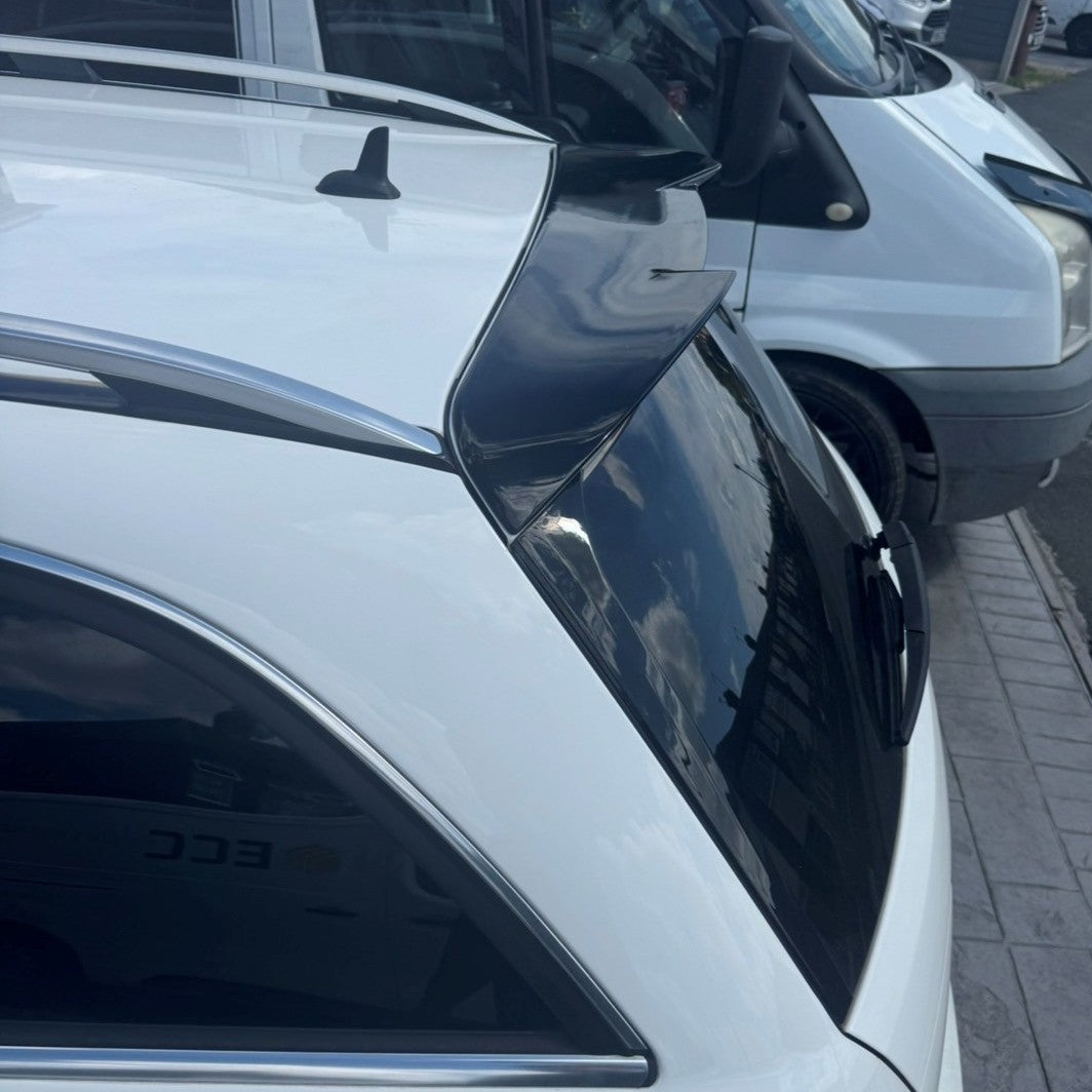 Gloss black AMG style boot spoiler for Mercedes Benz W204 C-Class and C63 estate models, 2007-2014, shown on vehicle rear.