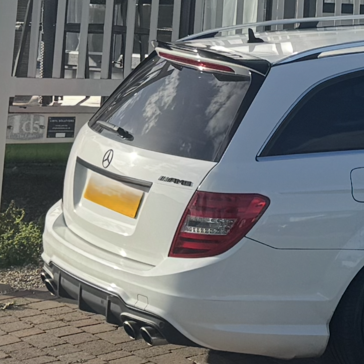 Gloss black AMG style boot spoiler for Mercedes Benz W204 C Class and C63 Estate, rear trunk lid accessory, sleek aerodynamic design.