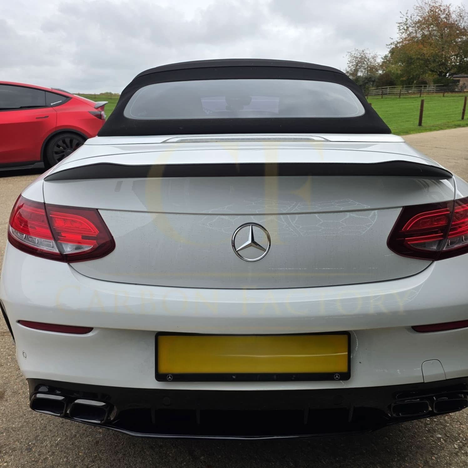 Carbon fibre boot spoiler for Mercedes Benz A205 C Class Convertible 2015-2021, showing its sleek design and aerodynamic profile.