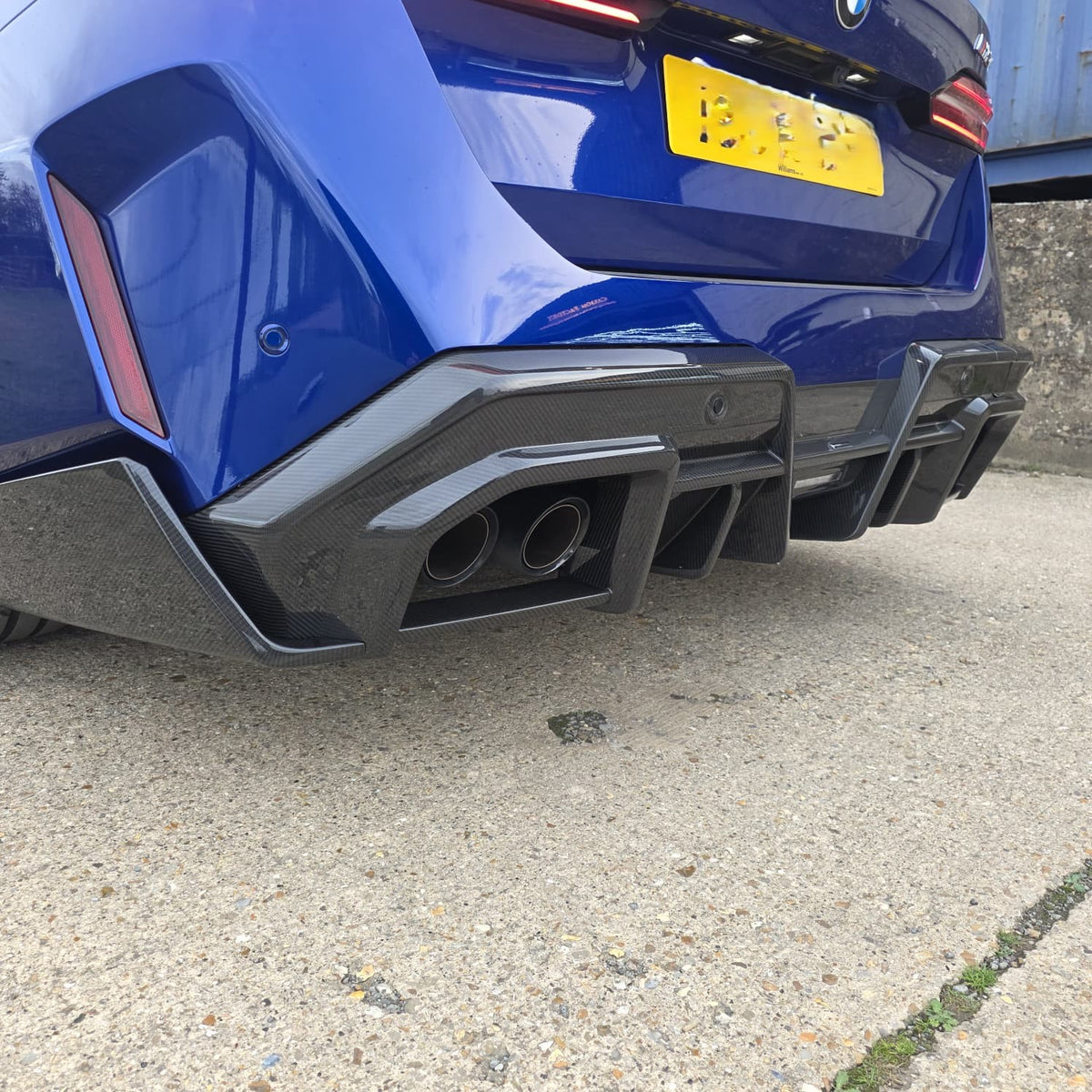 Pre-Preg Carbon fiber rear diffuser for BMW G90 G99 M5, sleek aerodynamic design for enhanced performance and style.