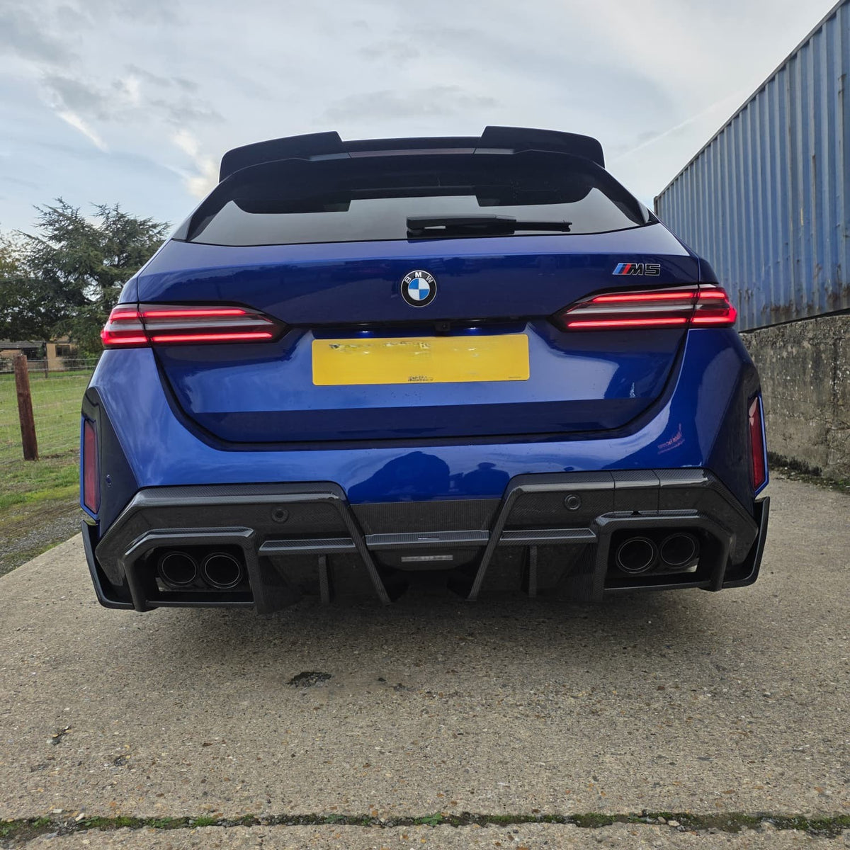 Pre-Preg Carbon fiber rear diffuser for BMW G90 G99 M5 2025+ models, showcasing sleek aerodynamic design.