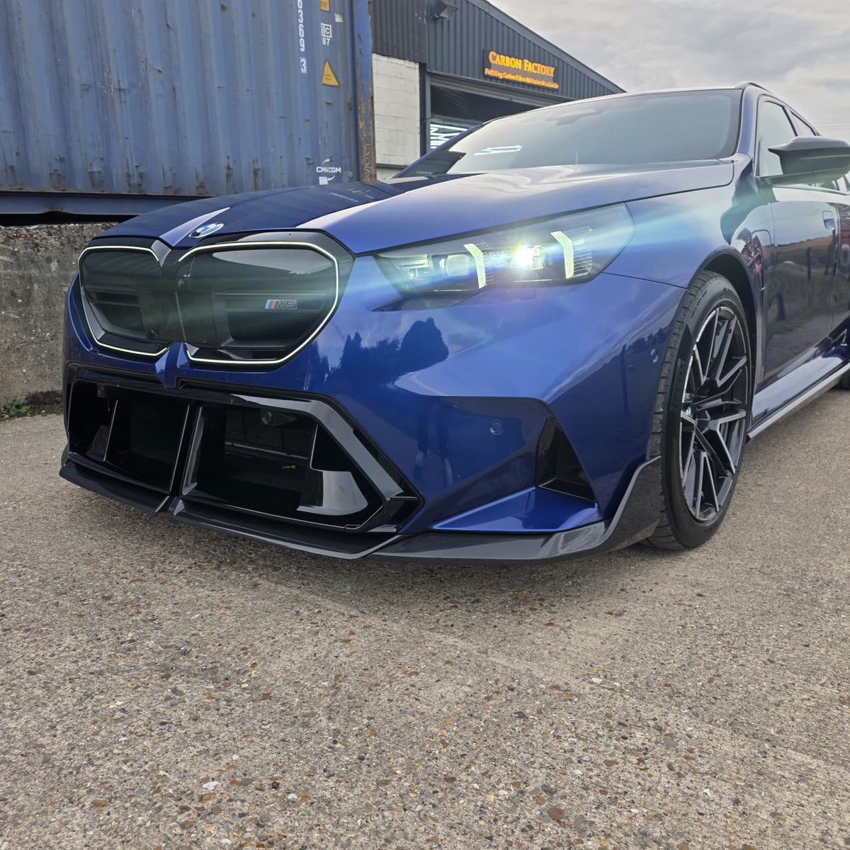 Pre-Preg Carbon fiber front splitter for BMW G90 G99 M5 2025-present, showcasing sleek aerodynamic design and high-quality finish.