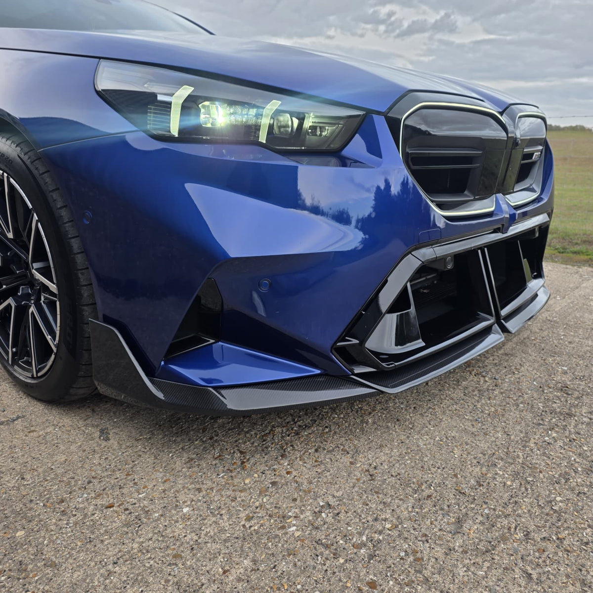 Pre-Preg Carbon fibre front splitter for BMW G90 G99 M5 2025-present, showcasing sleek aerodynamic design and high-quality material