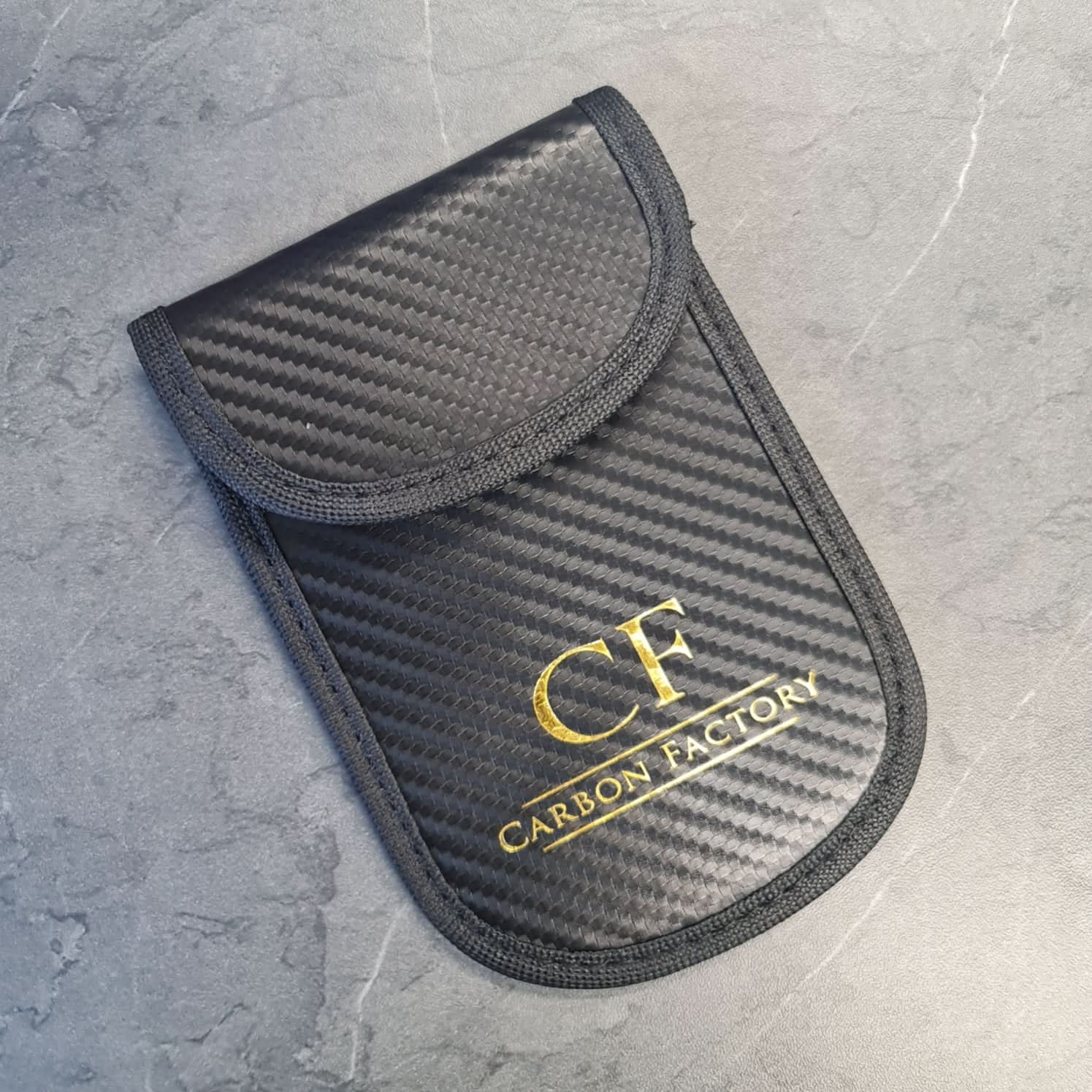 Carbon Factory car key signal blocker pouch, a protective accessory for securing key signal from interference or theft.