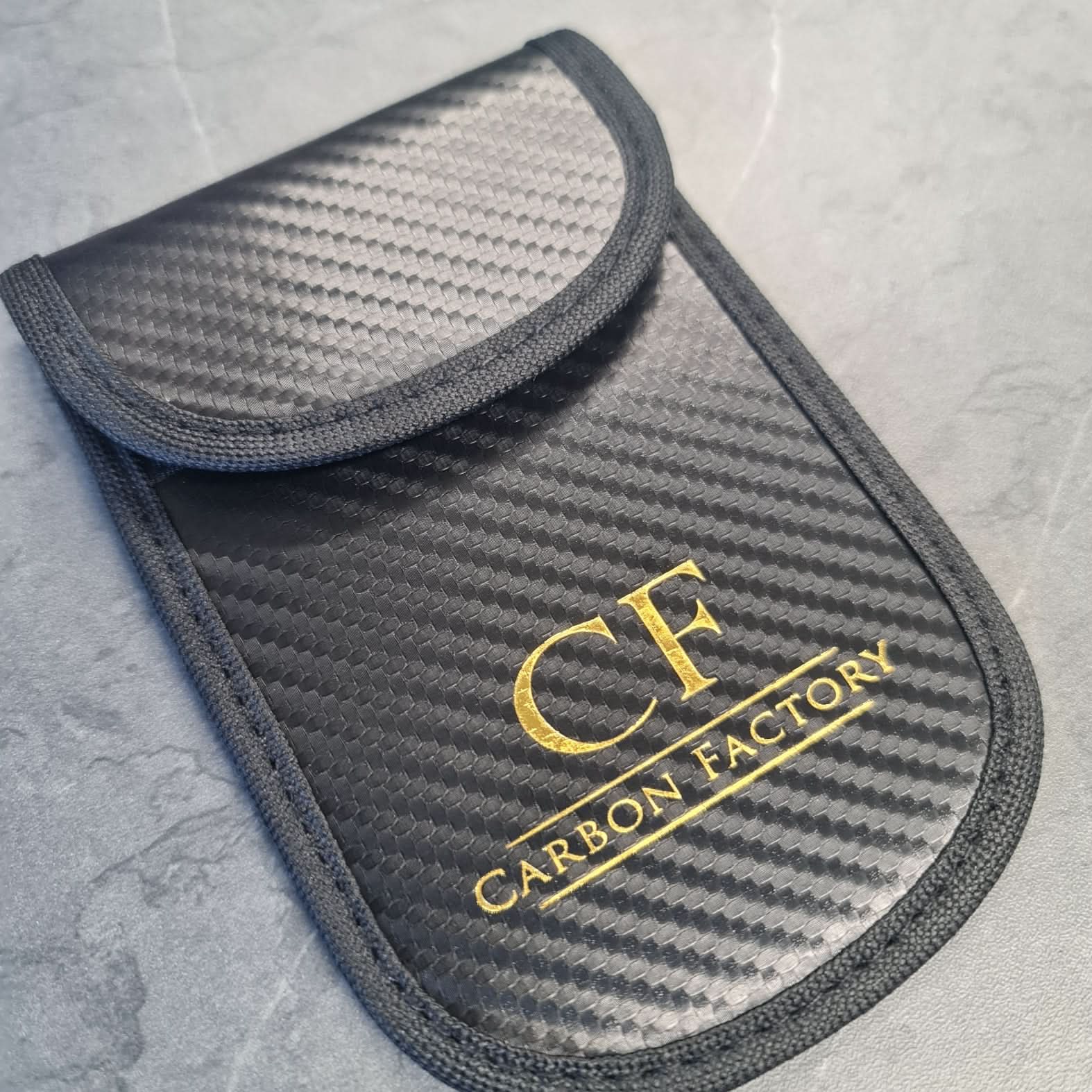 Carbon Factory car key signal blocker pouch, black accessory with compact design for key signal protection.