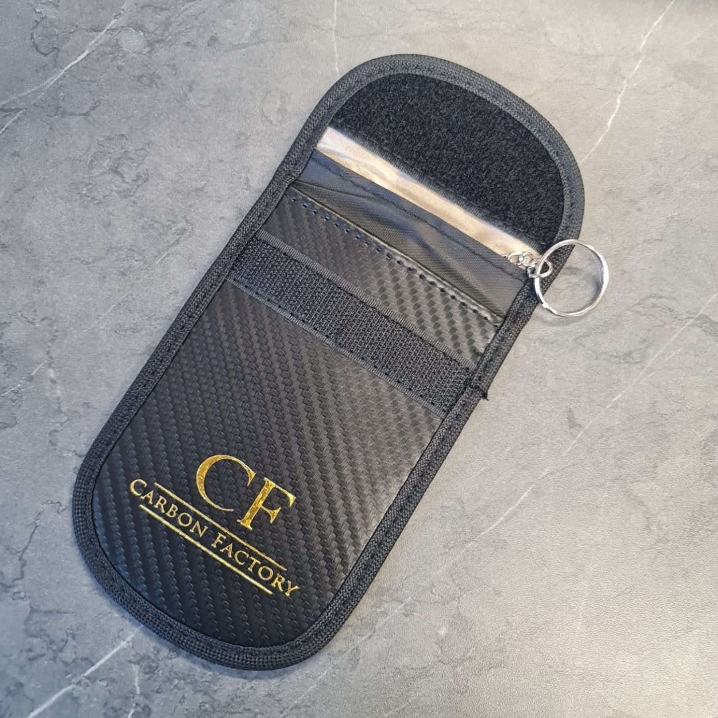 Carbon Factory car key signal blocker pouch, compact accessories pouch with black fabric, designed to prevent key signal theft.