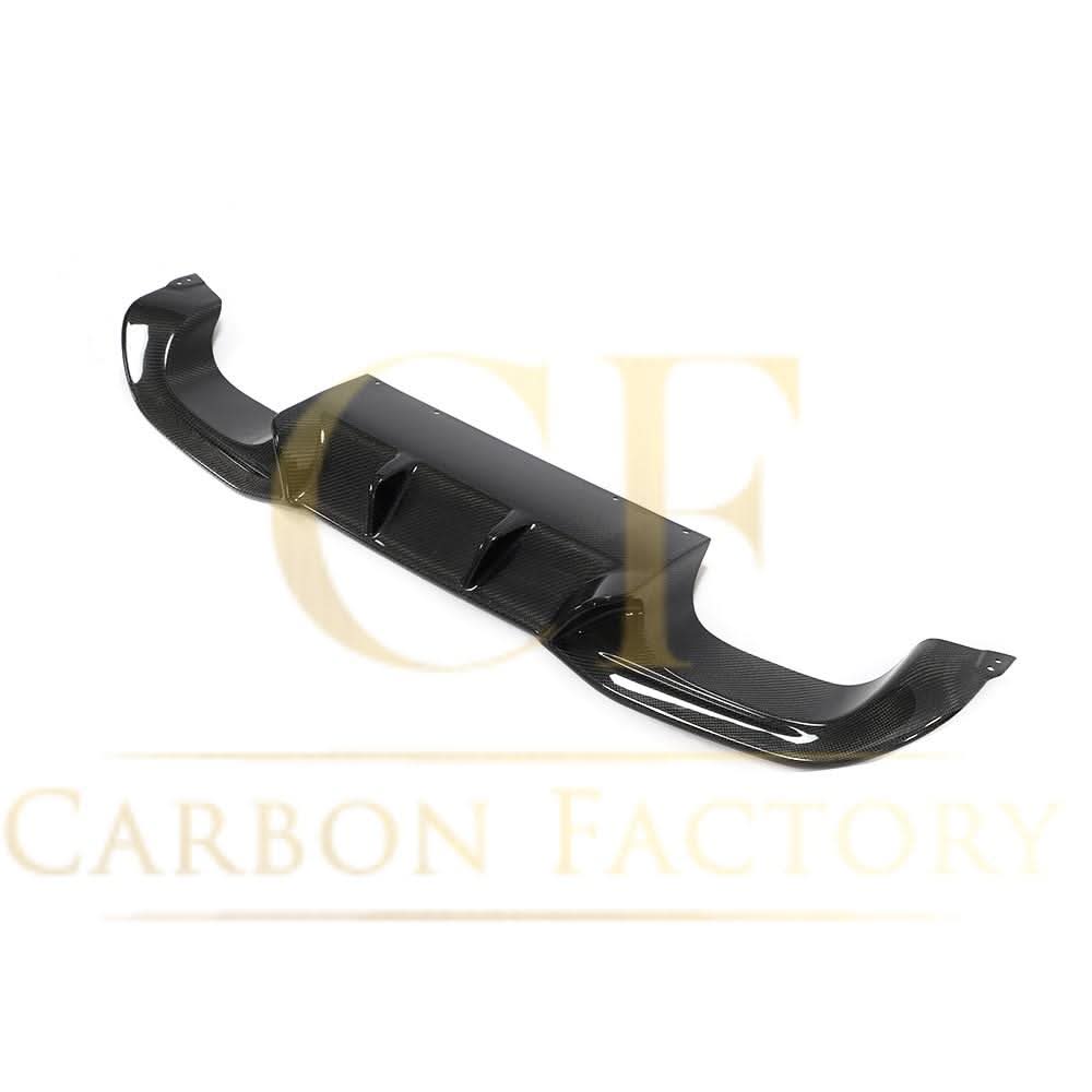 Carbon fibre rear diffuser for BMW F87 M2, designed by AK Style, featuring a sleek, aerodynamic enhancement for 2016-2021 models.