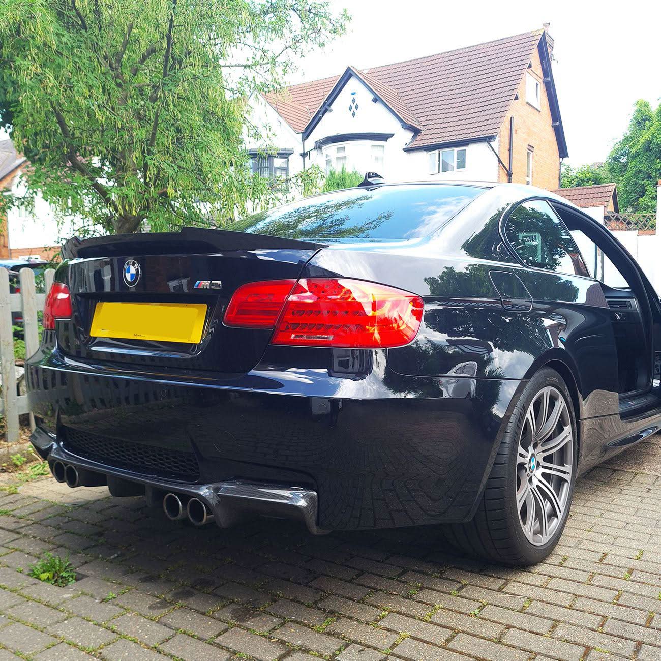V2 style carbon fibre rear diffuser for BMW E92 E93 M3 2007-2013, showcasing sleek aerodynamic design and high-quality material.