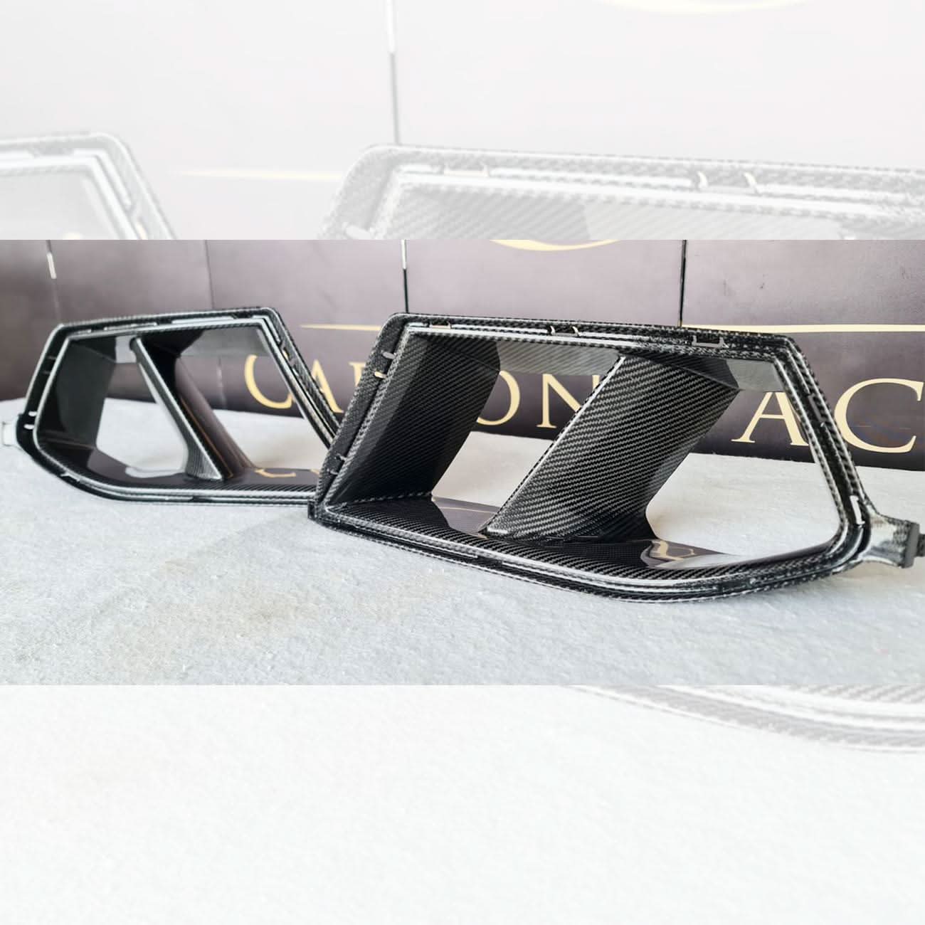 Carbon fibre front bumper inserts for BMW G80 M3, G82 G83 M4, exterior trims with a sleek carbon fibre finish.