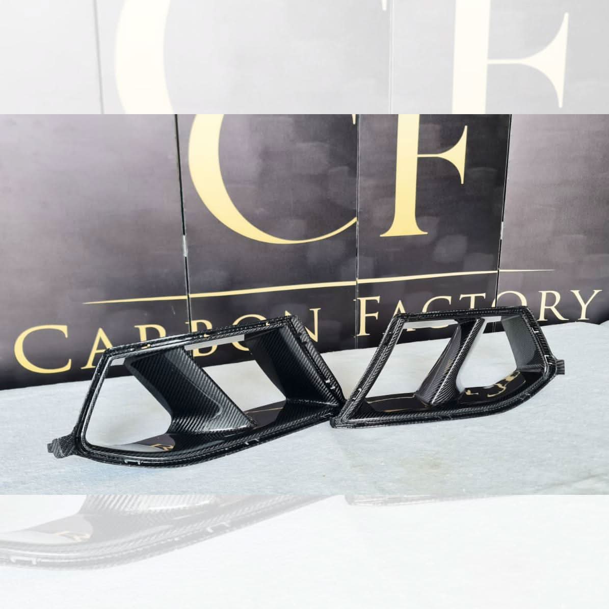 Carbon fibre front bumper inserts for BMW G80 M3, G82 G83 M4 exterior trims, showcasing sleek, lightweight automotive design.