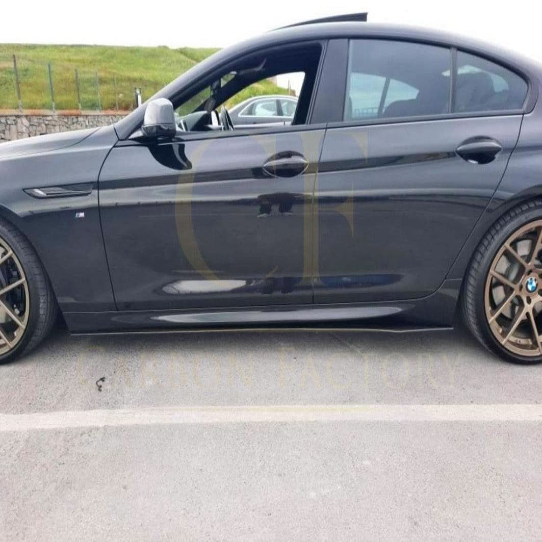 A set of A-Style universal carbon fiber side skirts for a vehicle, showcasing sleek, lightweight aerodynamic design.