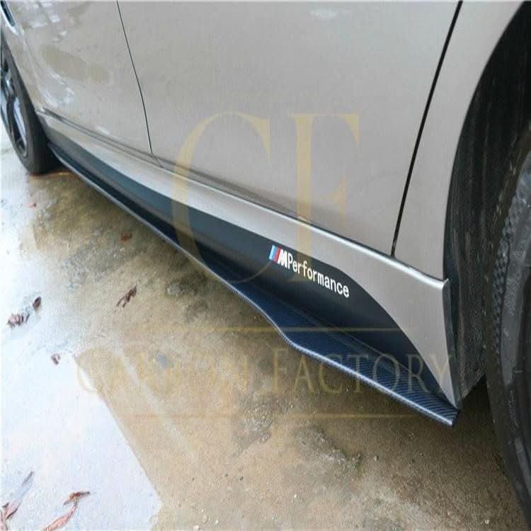 A close-up of A-Style universal carbon fibre side skirts showing their sleek, lightweight design for car exterior enhancement.