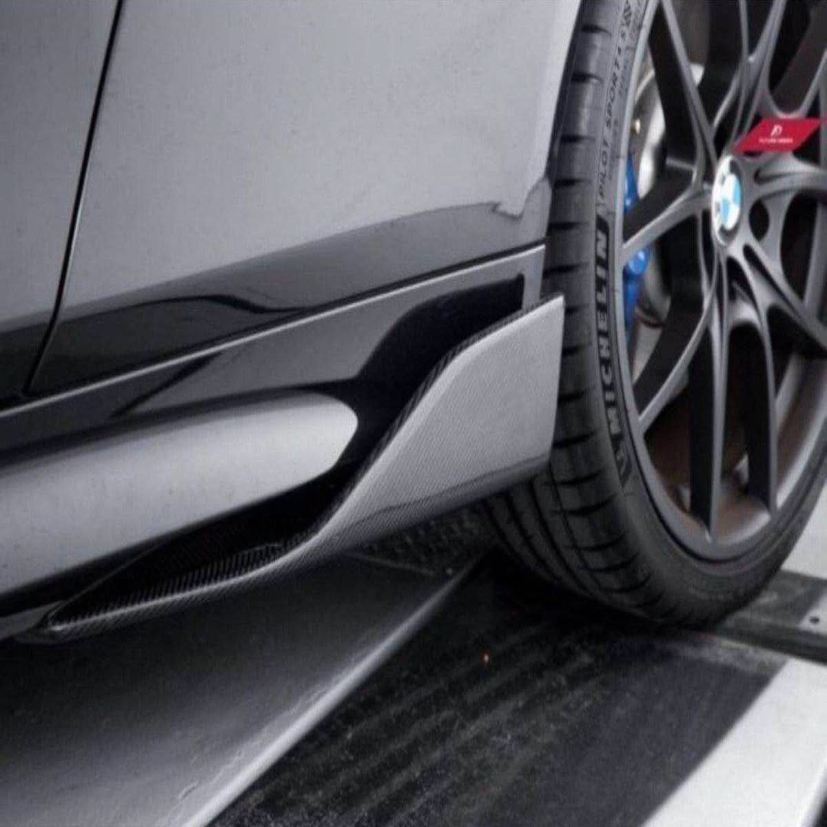 Carbon Fibre E Style universal side skirts for cars, showcasing sleek, lightweight aerodynamic design with a glossy finish.