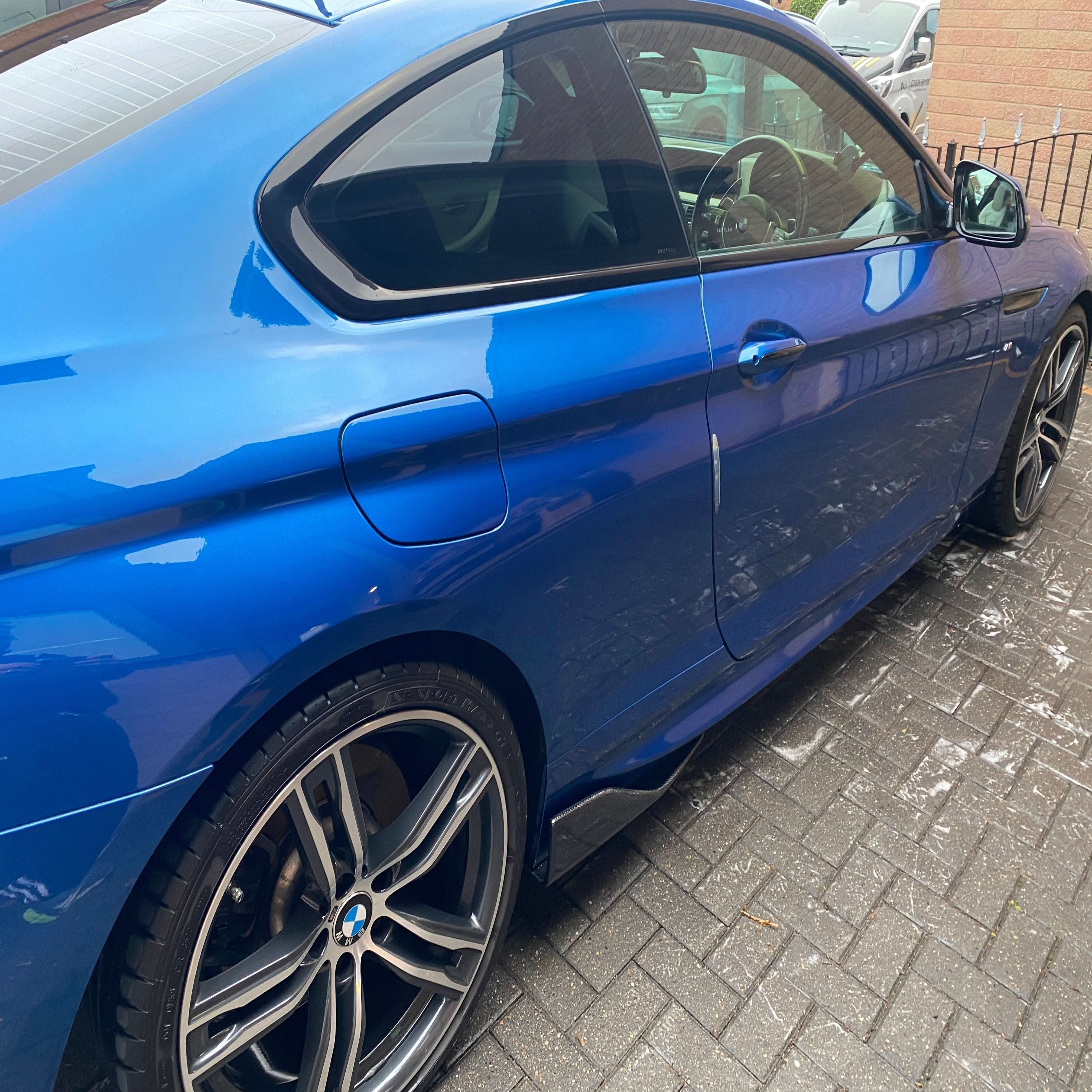 Universal Carbon Fibre Side Skirts by E Style, showcasing sleek, lightweight side skirts with a textured carbon fiber finish.