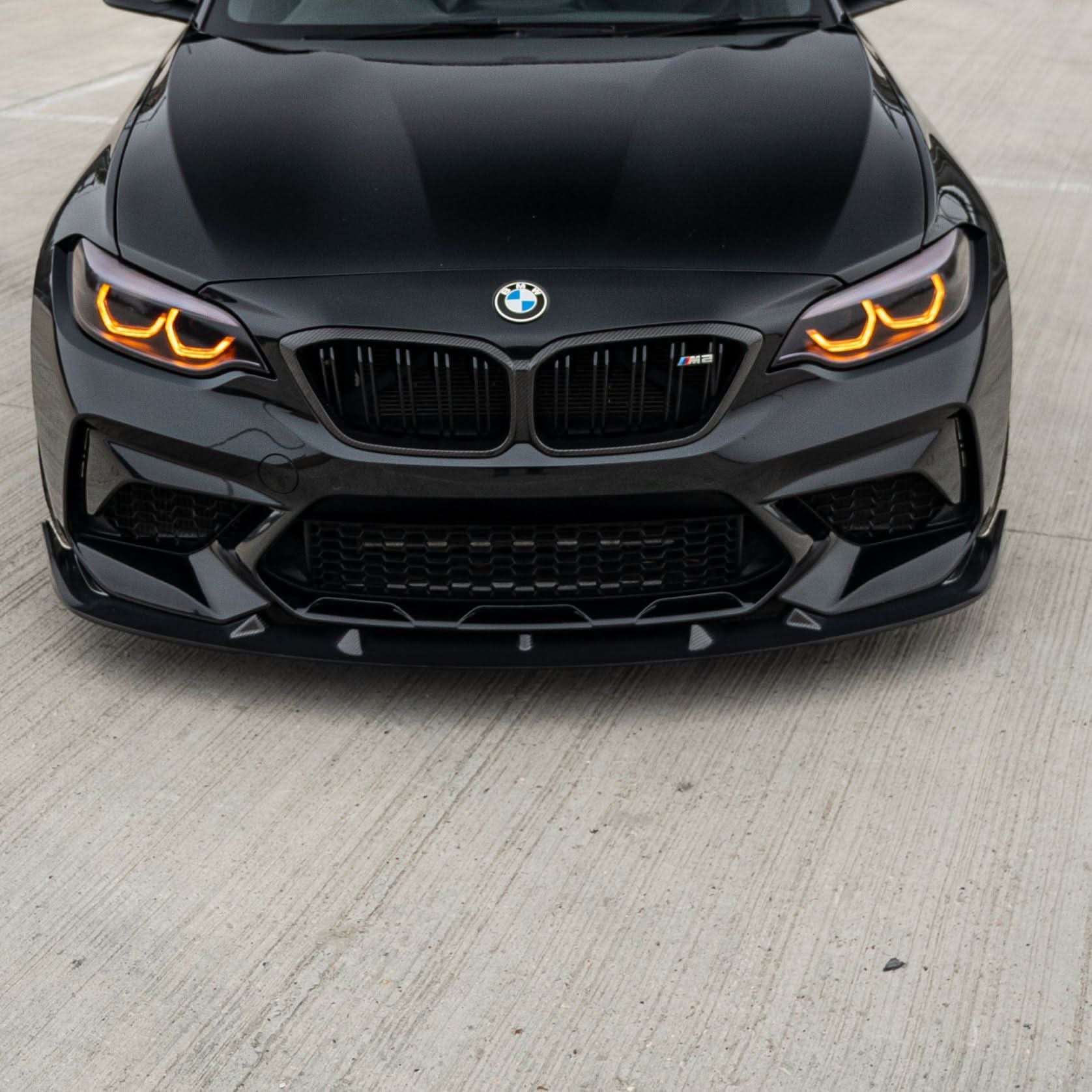 V Style carbon fiber front splitter for BMW F87 M2C Competition model, enhancing aerodynamics and sporty appearance.