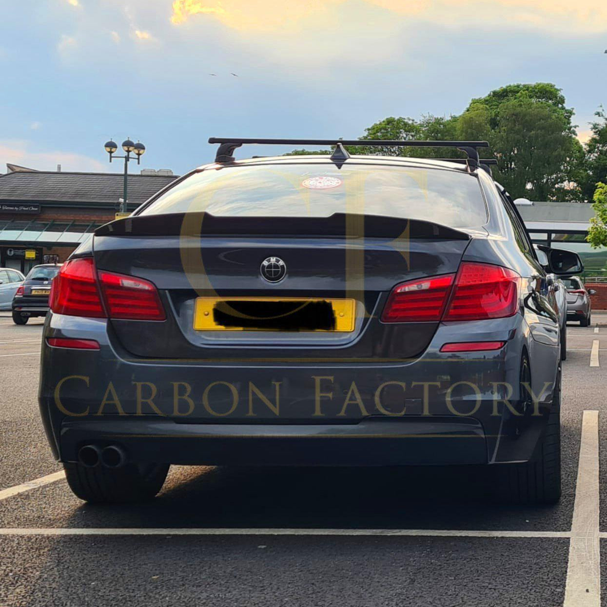 Carbon fibre BMW 5 Series F10 boot spoiler with PSM Style design, including M5 model, enhancing sporty rear aerodynamic look.