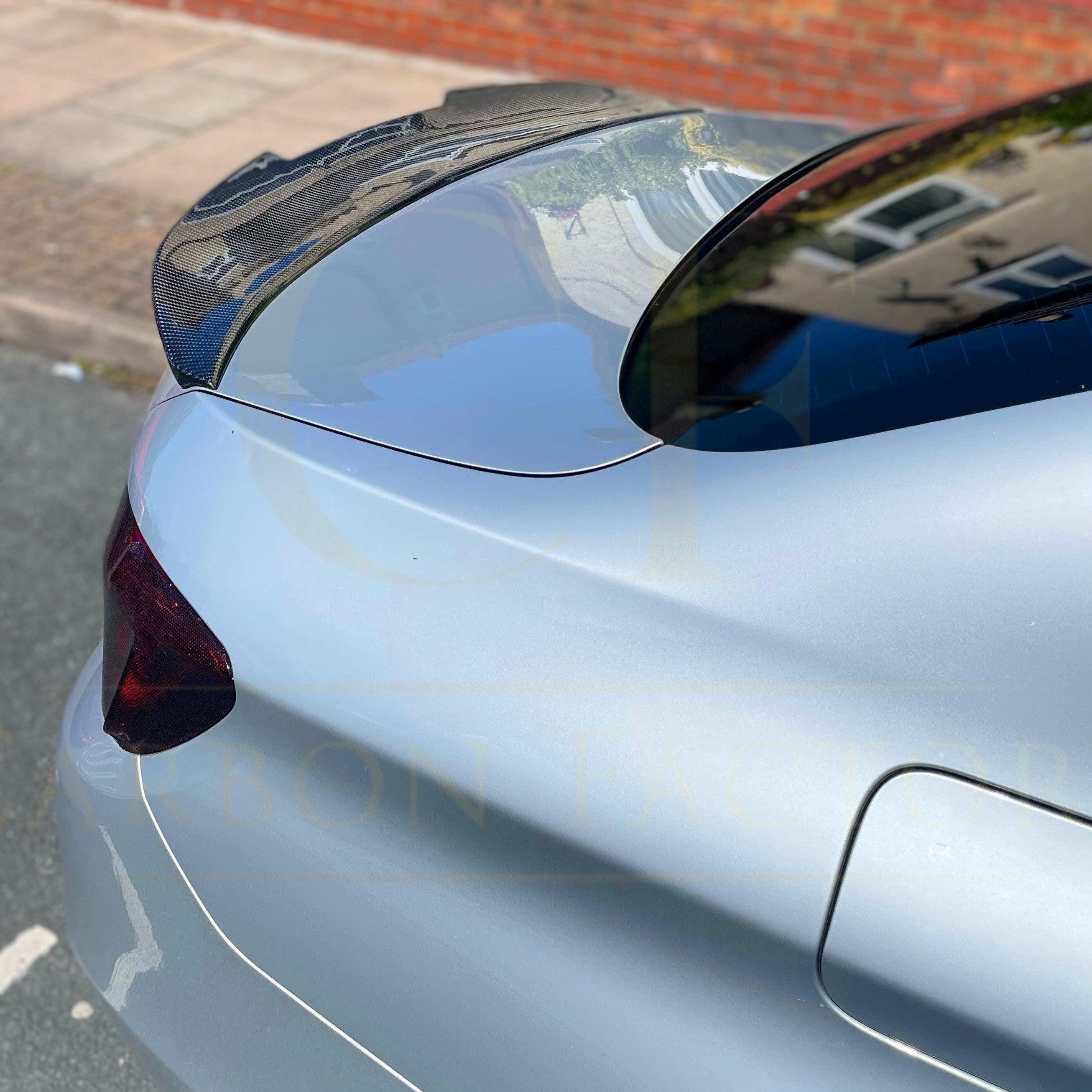 Carbon fibre boot spoiler for BMW 5 Series F10 and M5, showcasing sleek aerodynamic design and lightweight construction.