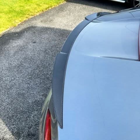 V Style carbon fiber boot spoiler for BMW E89 Z4 2009-2015, showcasing sleek aerodynamic design and high-quality material.