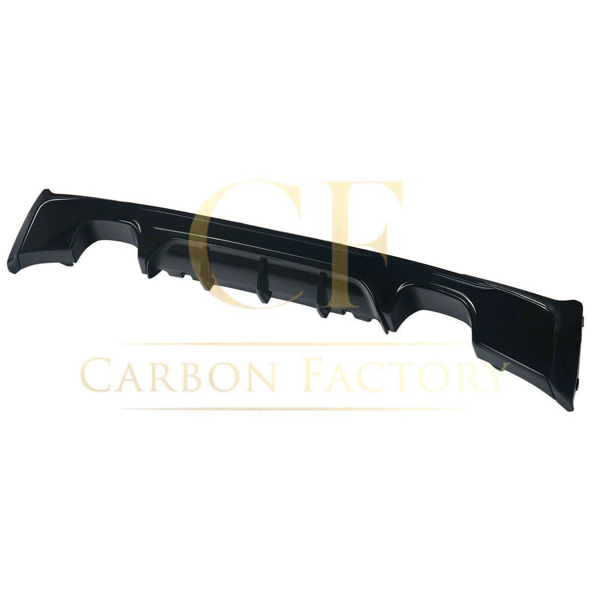Gloss black rear diffuser with quad exhaust tips for BMW F22 2 Series M Sport, showing the sporty aerodynamic design.