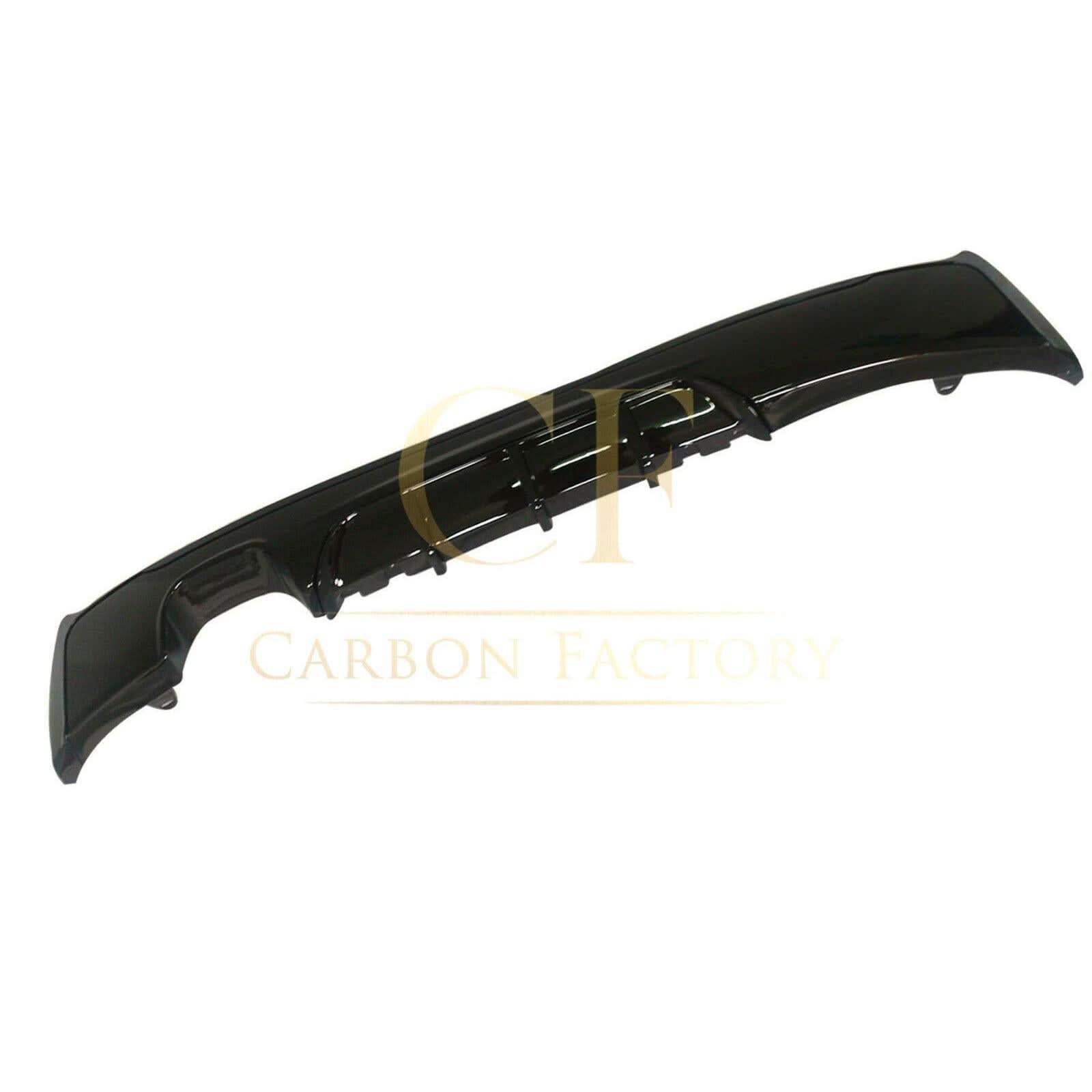 Gloss black rear diffuser with twin exhaust tips for BMW F22 2 Series M Sport, enhancing sporty appearance and aerodynamics.