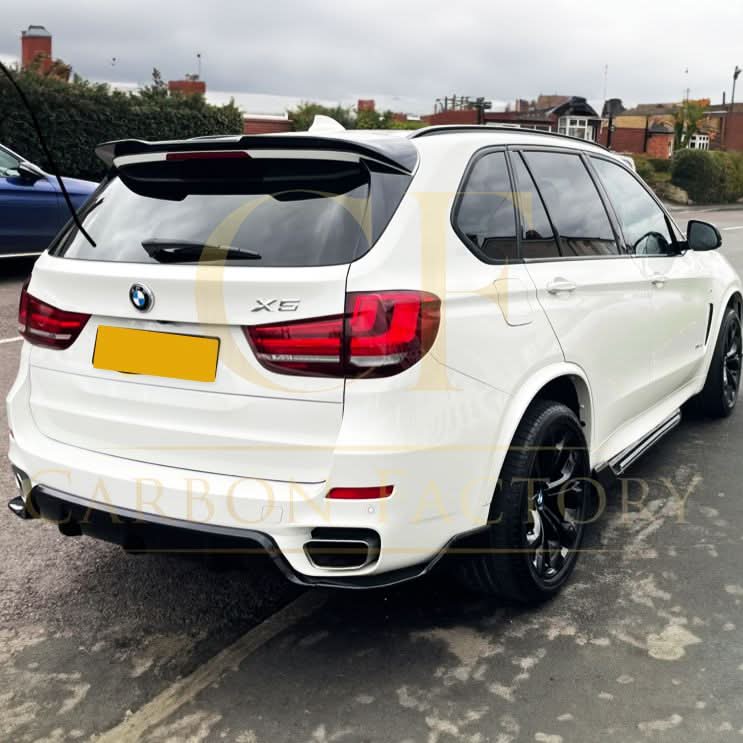 Gloss black BMW F15 X5 body kit with side skirts, splitter, diffuser, and spoiler, featuring carbon factory style design.
