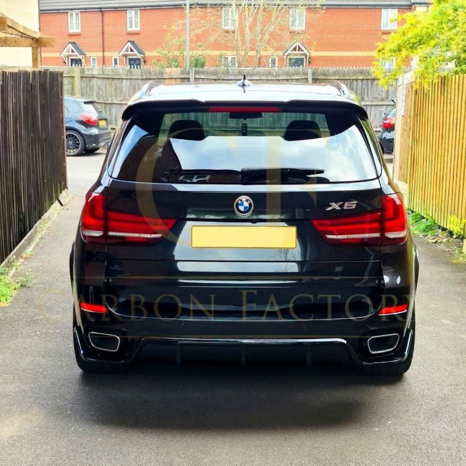 Gloss black BMW F15 X5 body kit with side skirts, splitter, diffuser, and spoiler, featuring carbon factory style design.