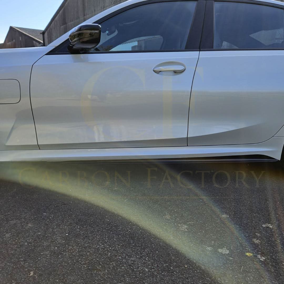 Gloss black MP Style side skirts for BMW 3 Series G20 G21, sleek automotive body kit enhancement in matte black finish.