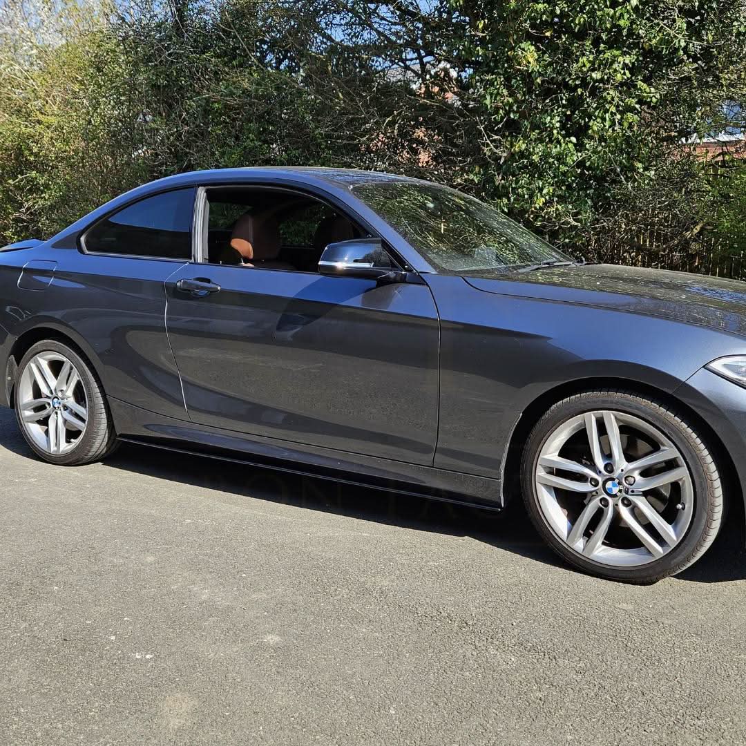 Gloss Black MP Style side skirt for BMW F22 2 Series and F87 M2, enhances sporty appearance with sleek black finish.