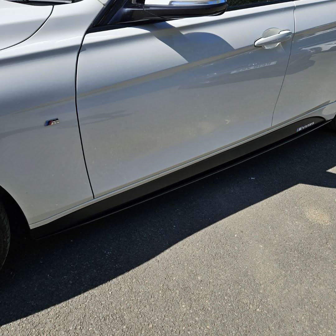 Gloss Black MP Style side skirts for BMW F30 F31 3 Series 2012-2019, showing sleek gloss black finish and aerodynamic design.