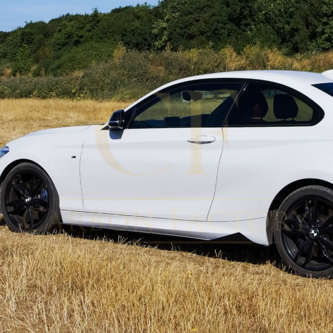 Gloss black side skirts for BMW F22 2 Series F87 M2, stylish MTC Style exterior accessory, visible on vehicle in image.
