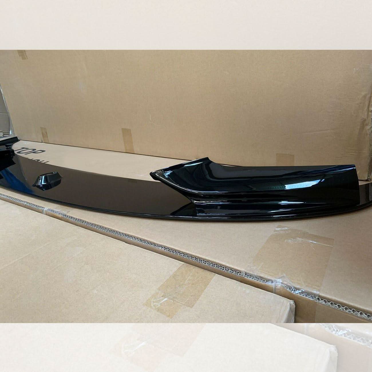 Gloss black front splitter for BMW F10 F11 5 Series, featuring a sleek design for improved aerodynamics.