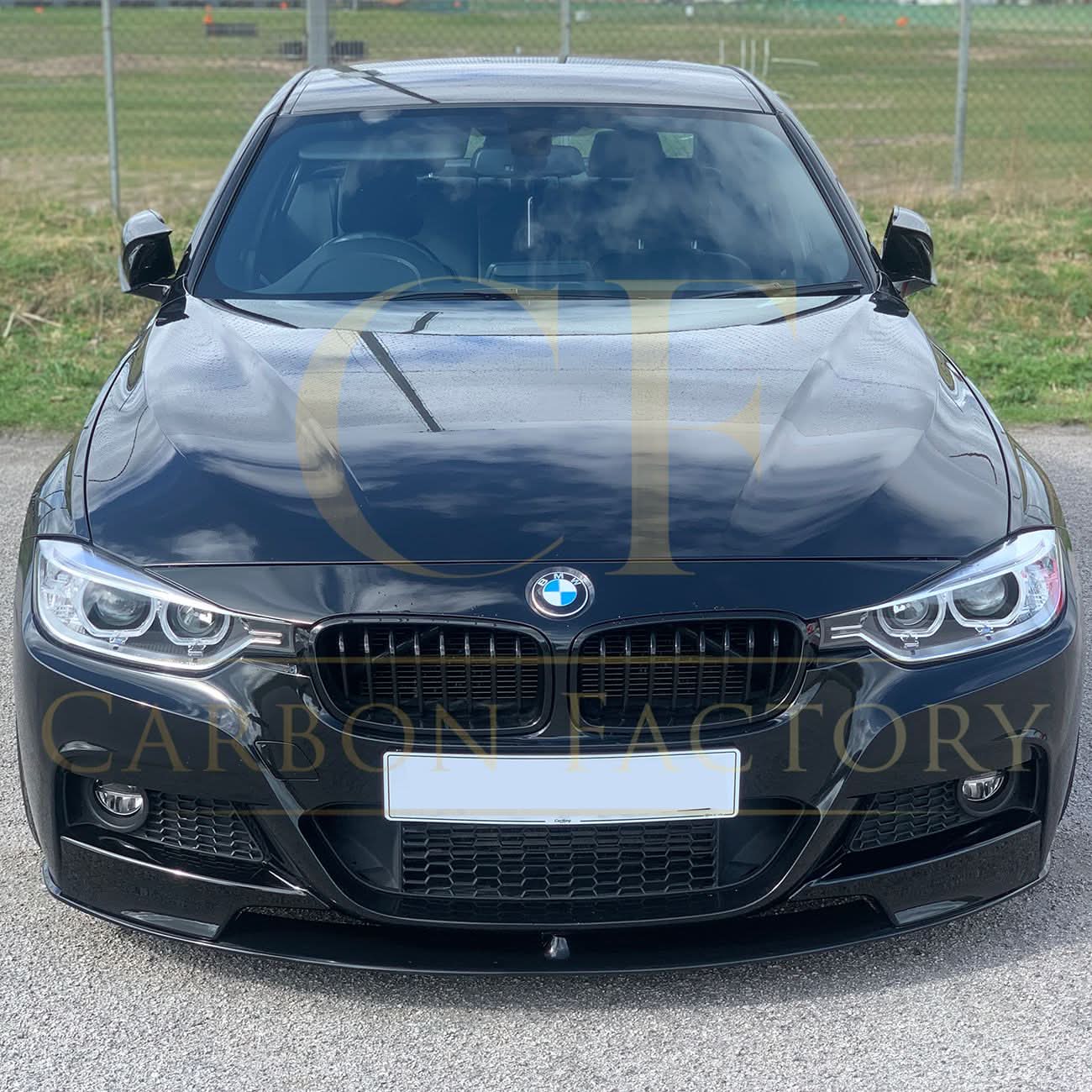 Gloss black MP Style front splitter for BMW F30 F31 3 Series M Sport, showing its aerodynamic design and attachment points.