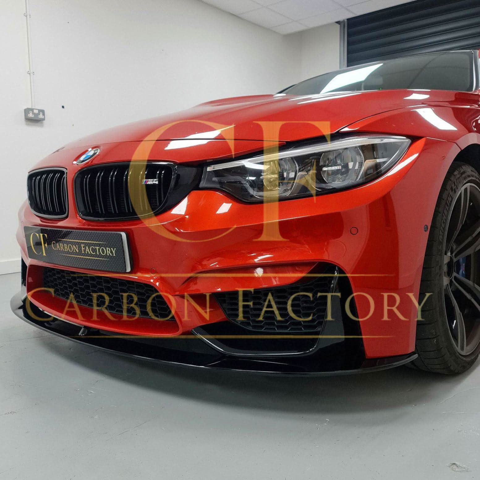 Gloss black MP Style front splitter for BMW F80 M3, F82, F83 M4 models from 2014 to 2020, shown on the vehicle's front bumper.
