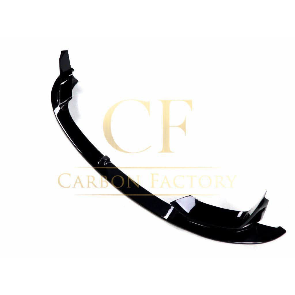 Gloss black MP style front splitter for BMW F80 M3, F82 F83 M4 models, enhancing sporty front aerodynamic appearance.