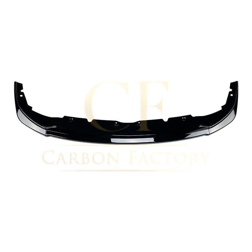 Gloss Black RS Style front splitter for BMW F40 1 Series 2019-2024, shows the aerodynamic design and mounting details.