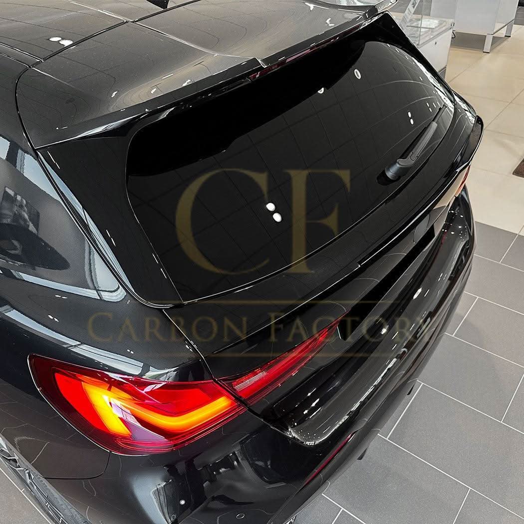 Gloss Black mid spoiler for BMW F40 1 Series 2019-2024, showing the sleek, aerodynamic design on the vehicle's rear.
