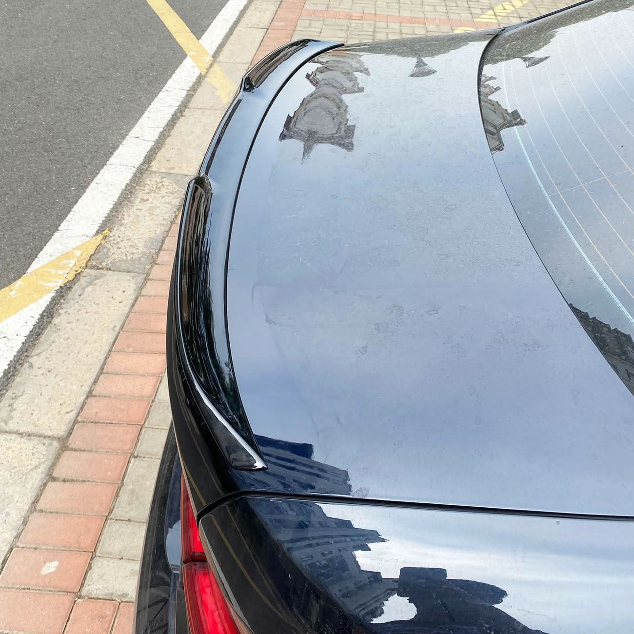 Gloss black M3-style boot spoiler for BMW G20 3 Series G80 M3, installed on the trunk lid, enhancing sporty appearance.