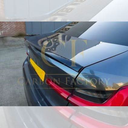 Gloss black MP Style boot spoiler on a BMW G20 3 Series G80 M3, showcasing sleek aerodynamic design.