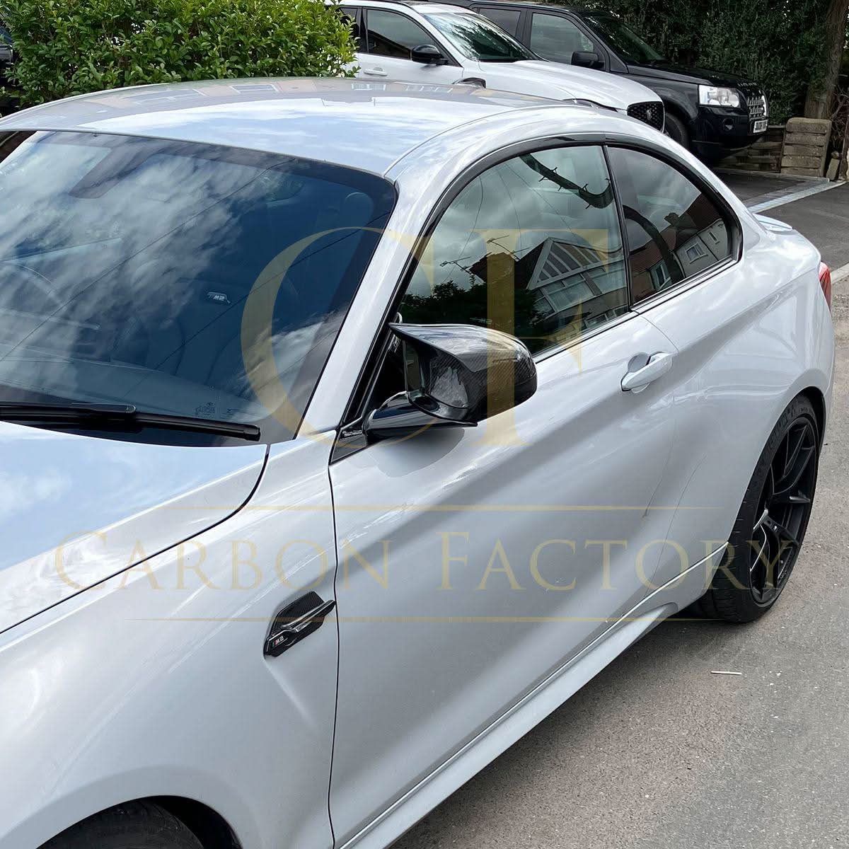 Pre-Preg Carbon fibre replacement mirror covers for BMW F80 M3, F82 F83 M4, F87 M2 Comp, right-hand drive, front view.