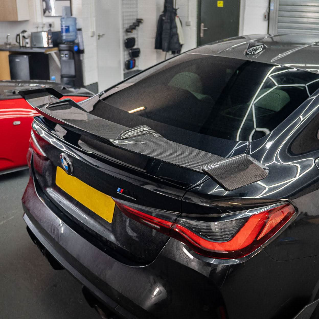 Pre-Preg Carbon fibre boot spoiler for BMW G80 M3 and G82 M4, featuring sleek aerodynamic design and high-quality carbon finish.