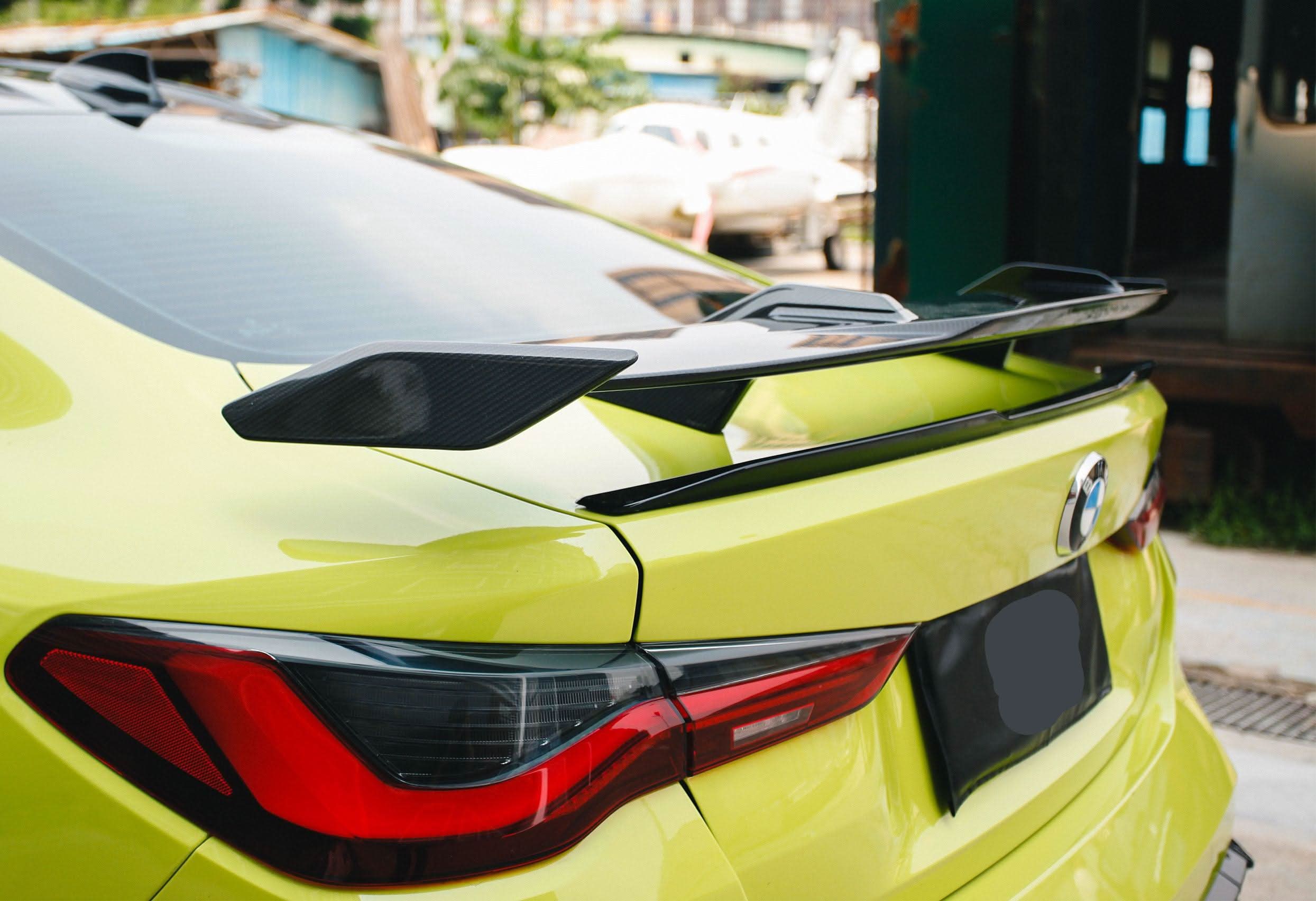Pre-Preg carbon fiber boot spoiler for BMW G80 M3 and G82 M4, showcasing sleek aerodynamic design and high-quality material.
